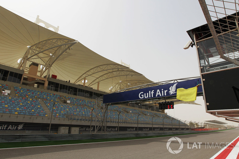 Yellow flag is waved at the start and finish straight