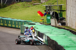 Lewis Hamilton, Mercedes AMG F1 W08, climbs out of his damaged car after crashing out of Q1