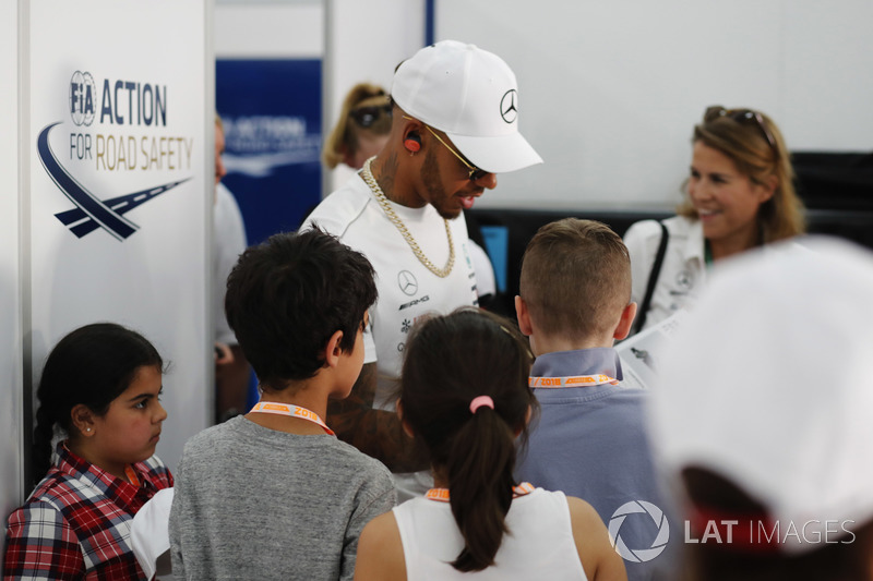 Lewis Hamilton, Mercedes AMG F1, signs autographs for fans