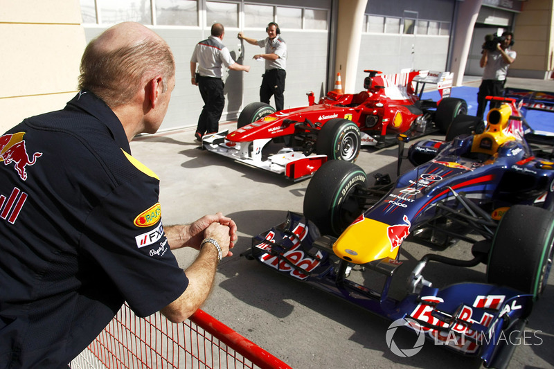 Adrian Newey of Red Bull Racing checks out the Red Bull RB5 Renault and Ferrari F10