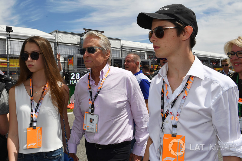 Michael Douglas, with his son Dylan Douglas, and daughter Carys Zeta-Douglas, on the grid