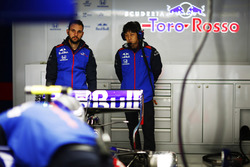 Toro Rosso and Honda team members in the team's garage