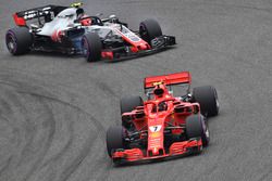 Kimi Raikkonen, Ferrari SF71H and Kevin Magnussen, Haas F1 Team VF-18