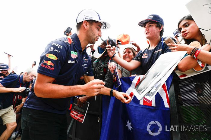 Daniel Ricciardo, Red Bull Racing, signs autographs for fans