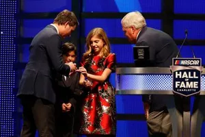 Rick Hendrick, Leo Gordon and Ella Gordon present a ring to Jeff Gordon