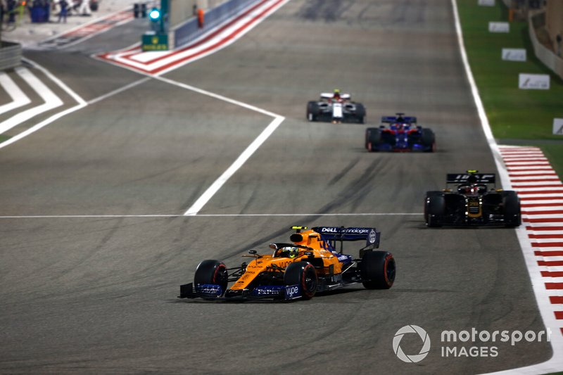 Lando Norris, McLaren MCL34, leads Kevin Magnussen, Haas F1 Team VF-19, Daniil Kvyat, Toro Rosso STR14, and Antonio Giovinazzi, Alfa Romeo Racing C38