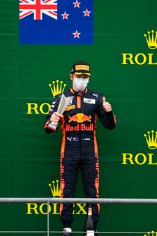 Liam Lawson, Hitech Grand Prix celebrates on the podium with the trophy