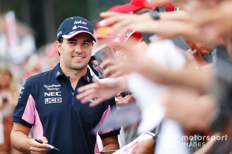 Sergio Perez, Racing Point, signs autographs for fans