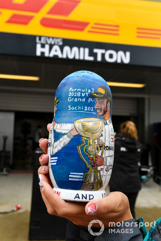 A matryoshka doll with an image of Lewis Hamilton, Mercedes AMG F1, painted on it