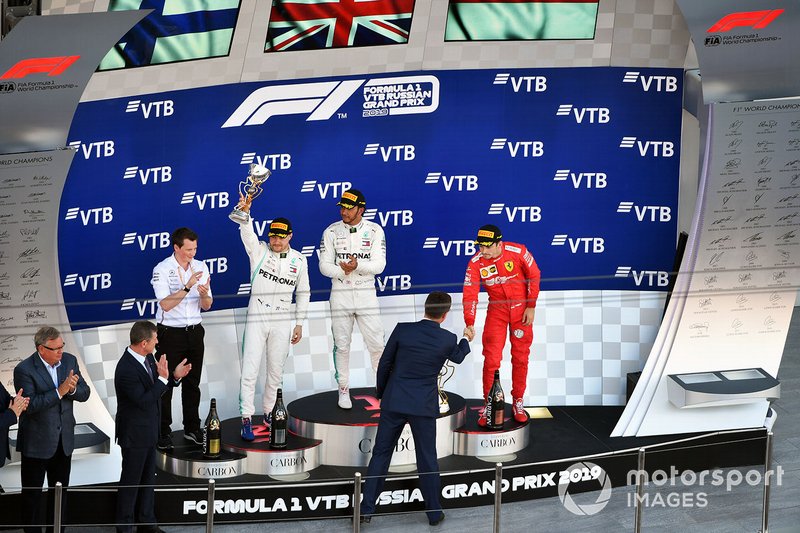 Fred Judd, Chief Engineer Trackside, Mercedes AMG F1, Valtteri Bottas, Mercedes AMG F1, 2nd position, Lewis Hamilton, Mercedes AMG F1, 1st position, and Charles Leclerc, Ferrari, 3rd position, on the podium