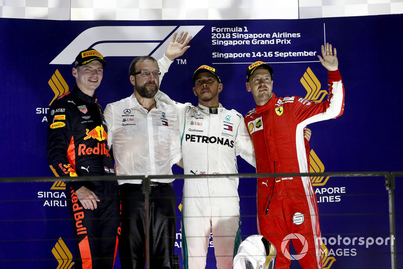 Max Verstappen, Red Bull Racing, 2nd position, the Mercedes Constructors Trophy delegate, Lewis Hamilton, Mercedes AMG F1, 1st position, and Sebastian Vettel, Ferrari, 3rd position, on the podium