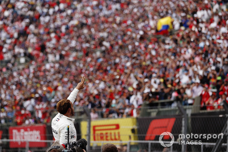 Lewis Hamilton, Mercedes AMG F1, celebrates with the fans as he celebrates winning his fifth World Championship