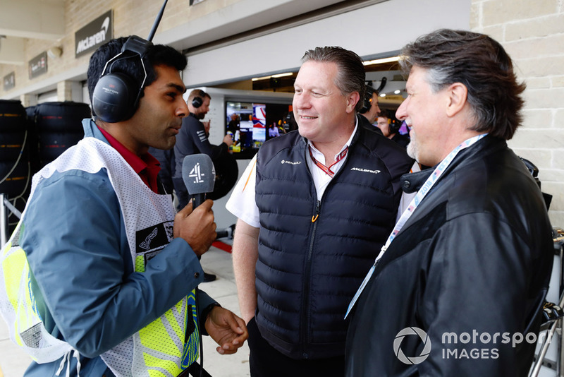 TV Presenter Karun Chandhok talks with Zak Brown, Executive Director, McLaren Racing, and Michael Andretti.