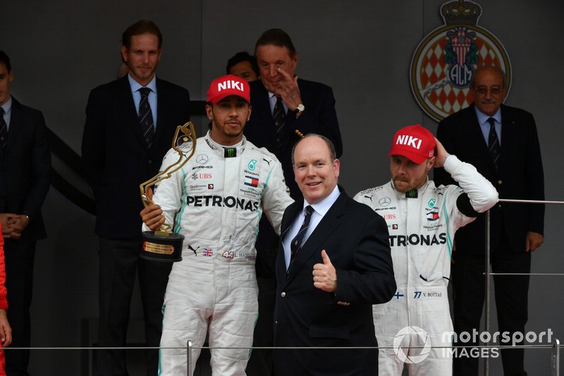 Lewis Hamilton, Mercedes AMG F1, 1st position, with his trophy alongside Prince Albert II on the podium