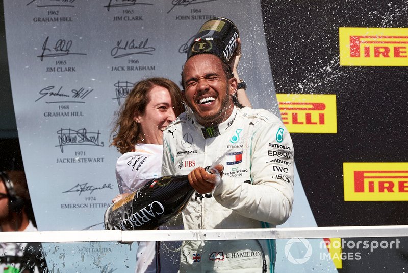 Lewis Hamilton, Mercedes AMG F1, 1st position, celebrates with his team mate on the podium