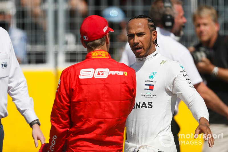 Lewis Hamilton, Mercedes AMG F1, and pole man Sebastian Vettel, Ferrari, after Qualifying