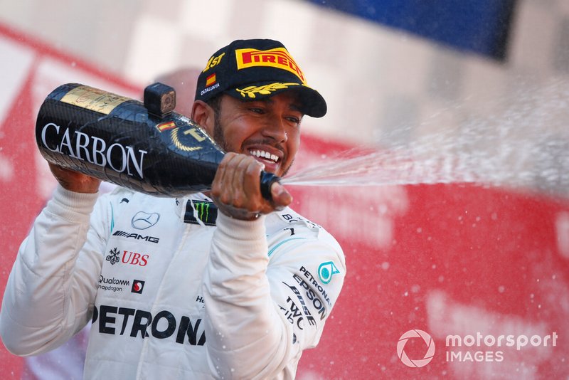Lewis Hamilton, Mercedes AMG F1, 1st position, sprays Champagne on the podium