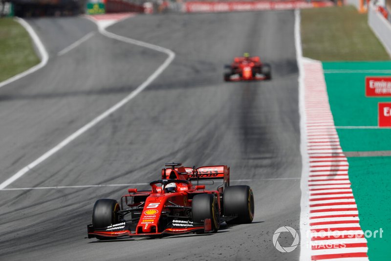 Sebastian Vettel, Ferrari SF90, leads Charles Leclerc, Ferrari SF90