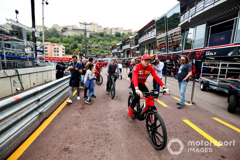 Charles Leclerc, Ferrari on a bike in the pit lane