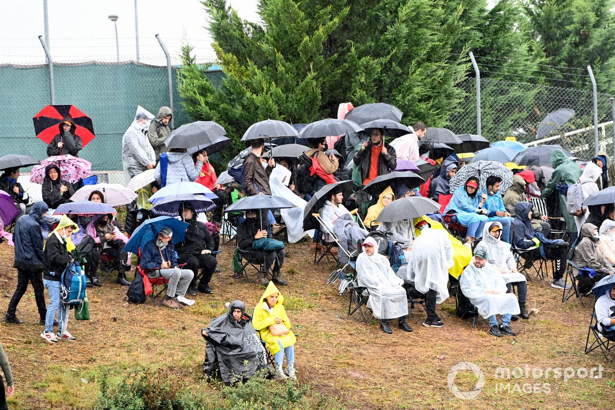 Fans watching race in the rain