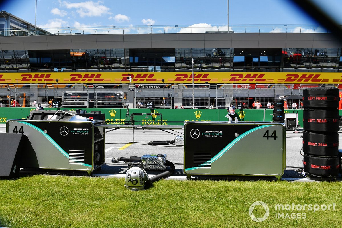 The Mercedes team prepare on the grid