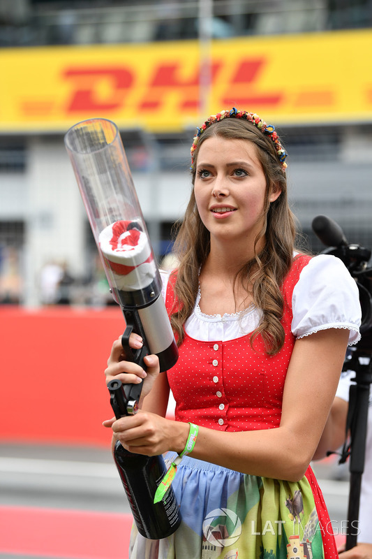 Grid girl fires T-Shirts into the crowd of fans, T-Shirt guns
