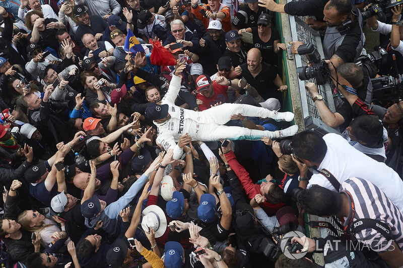Race winner Lewis Hamilton, Mercedes AMG F1, celebrates with the fans after winning the race