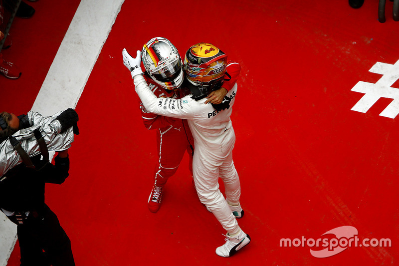 Winner Lewis Hamilton, Mercedes AMG, greets Sebastian Vettel, Ferrari, in parc ferme