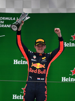 Max Verstappen, Red Bull Racing celebrates on the podium with the trophy