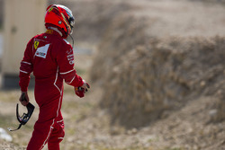 Kimi Raikkonen, Ferrari, walks back to his garage
