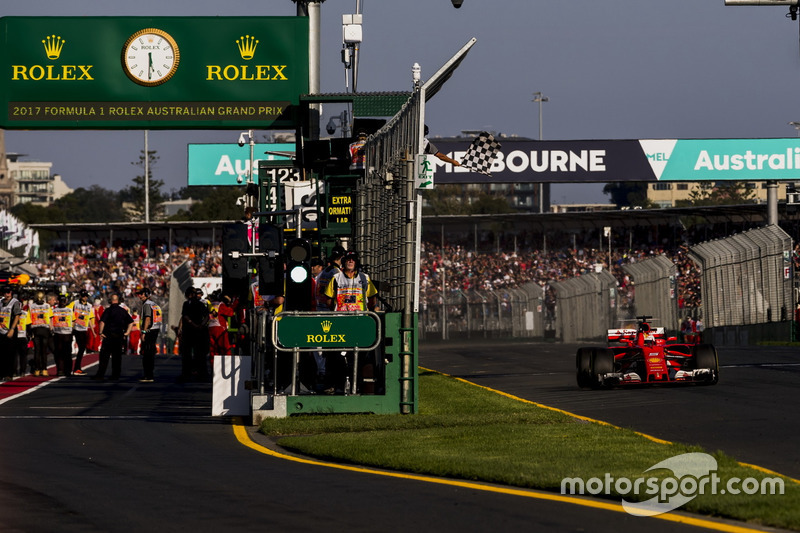 Sebastian Vettel, Ferrari SF70H, takes the chequered flag for victory