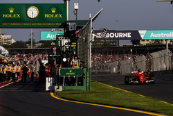 Sebastian Vettel, Ferrari SF70H, takes the chequered flag for victory