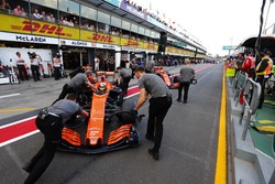 Fernando Alonso, McLaren MCL32, is returned to the garage