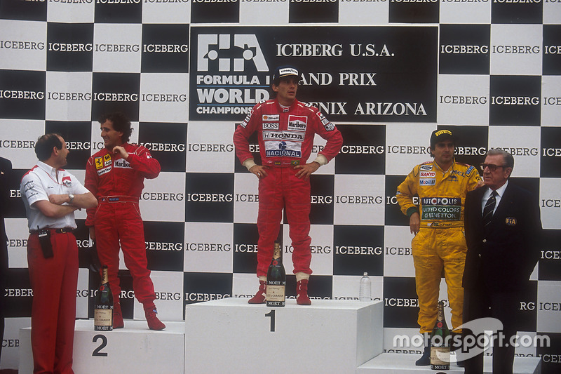 Ayrton Senna, McLaren Honda, 1st position, Alain Prost, Ferrari, 2nd position and Nelson Piquet, Benetton Ford, 3rd position on the podium. McLaren team boss Ron Dennis stands on the left and FIA President Jean-Marie Balestre on the right