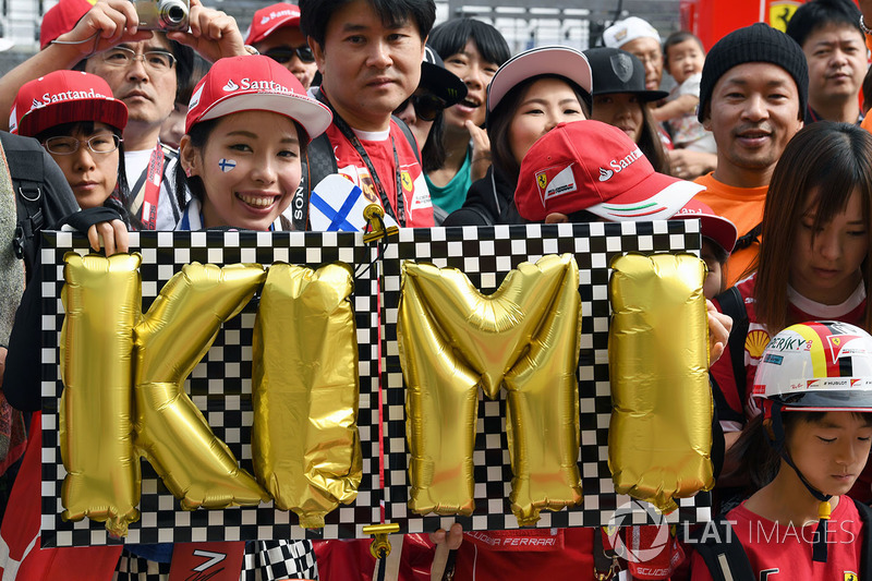 Kimi Raikkonen, Ferrari fans and banner