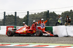 Kimi Raikkonen, Ferrari SF70H, climbs from his car after crashing