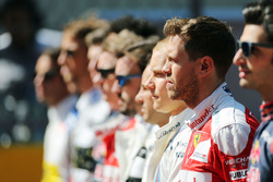 Sebastian Vettel, Ferrari as the grid observes the national anthem