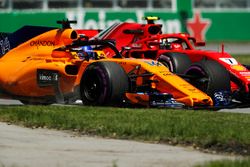 Stoffel Vandoorne, McLaren MCL33, races Kimi Raikkonen, Ferrari SF71H, in FP1