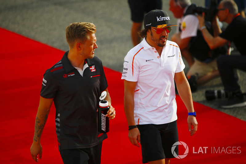 Fernando Alonso, McLaren, and Kevin Magnussen, Haas F1 Team, in the drivers parade