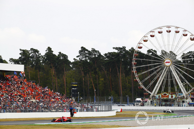 Sebastian Vettel, Ferrari SF71H, leads Charles Leclerc, Sauber C37