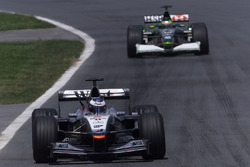 Mika Hakkinen, McLaren Mercedes MP4/16, leads Pedro de la Rosa, Jaguar R2