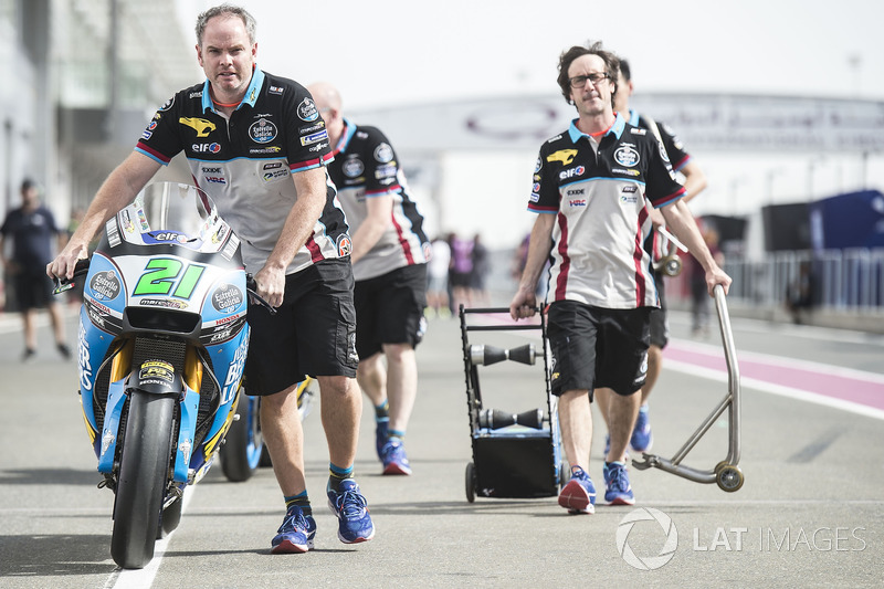 Matt pushing Morbidelli's Marc VDS Honda to scrutineering