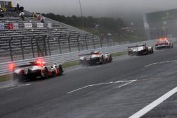 The start is given behind the safety car