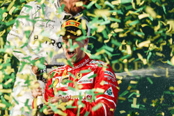 Confetti falls as Sebastian Vettel, Ferrari, 1st Position, celebrates