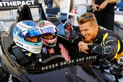 Mika Hakkinen takes Sergio Perez, Force India, forn a ride