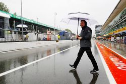  Eric Boullier, Racing Director, McLaren, in the wet pit lane