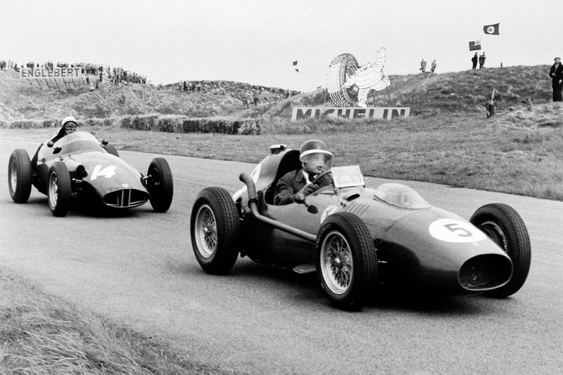 Mike Hawthorn, Ferrari Dino 246 leads Jean Behra, BRM P25