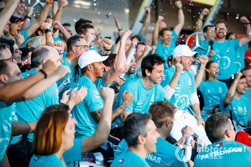 Valtteri Bottas, Mercedes AMG F1, 1st position, Lewis Hamilton, Mercedes AMG F1, 3rd position, and the Mercedes team celebrate after securing a win in the race and in the 2019 Constructors Championship