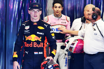 Max Verstappen, Red Bull Racing and Esteban Ocon, Racing Point Force India square up after the race following their on track crash