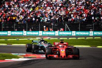 Sebastian Vettel, Ferrari SF71H, leads Lewis Hamilton, Mercedes AMG F1 W09 EQ Power+
